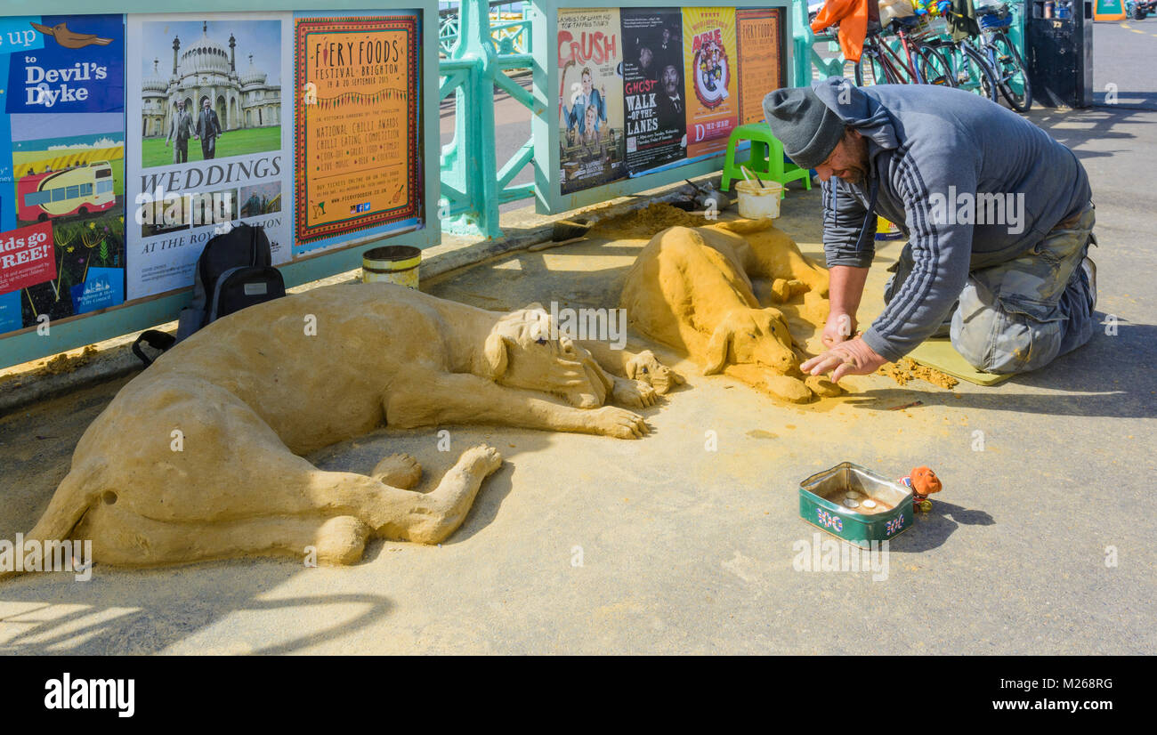 Artist making animal sand sculptures on a street in Brighton, East Sussex, England, UK. Stock Photo
