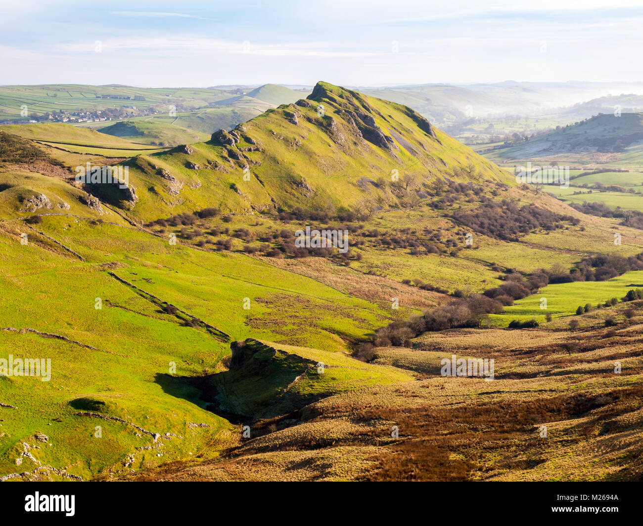 Chrome Hill in the Peak District National Park, UK with the village of Earl Sterndale in distance Stock Photo