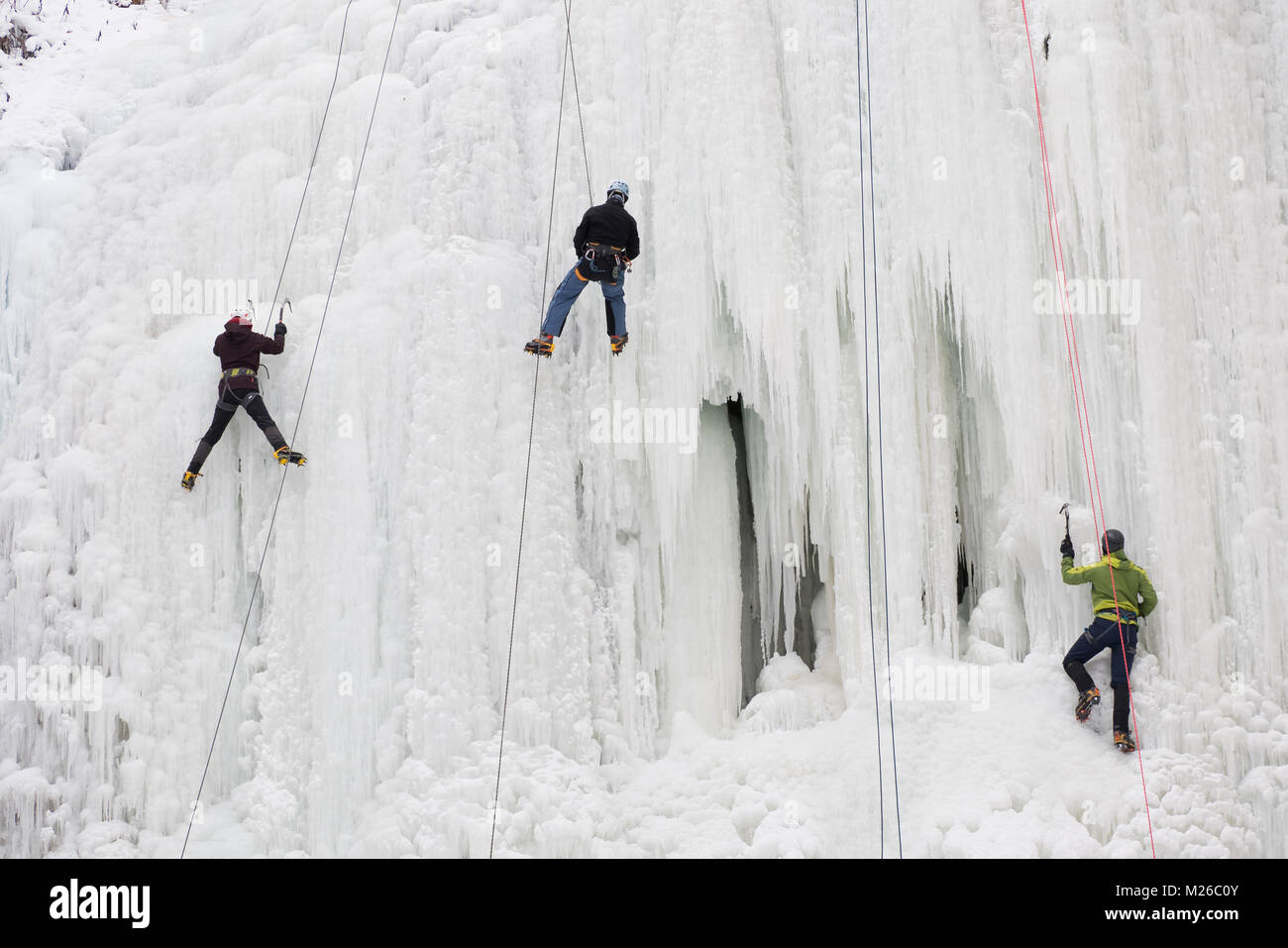 Climbing a frozen waterfall in Canada Stock Photo