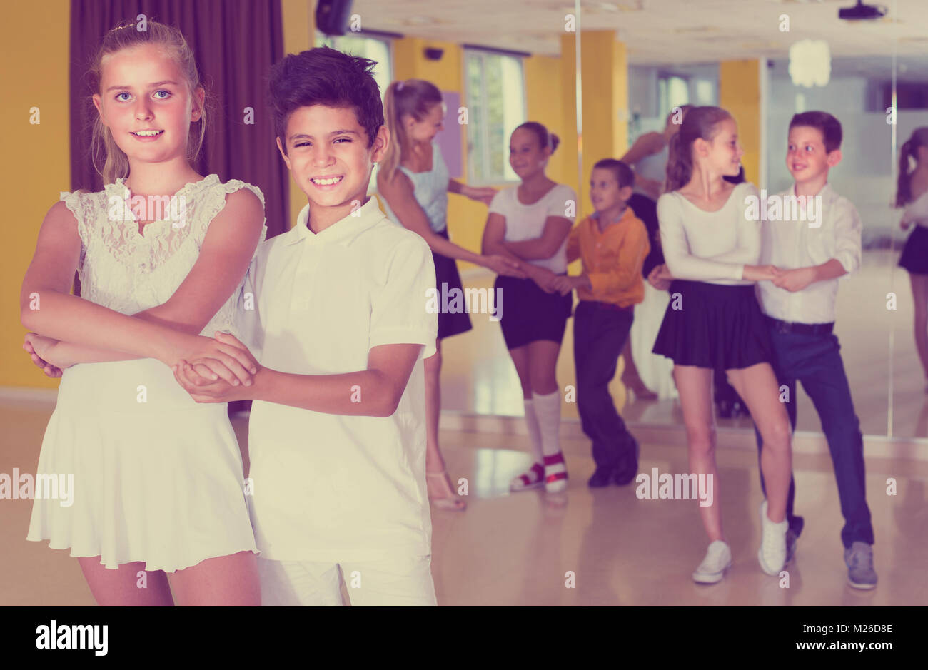 Kids are dancing in pairs in class Stock Photo Alamy