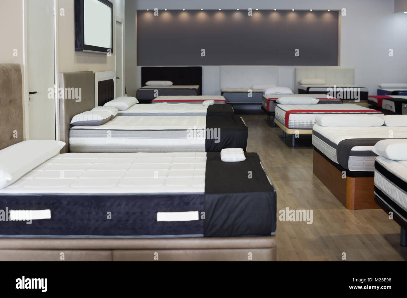 Photo of new comfortable mattresses in the shop Stock Photo Alamy