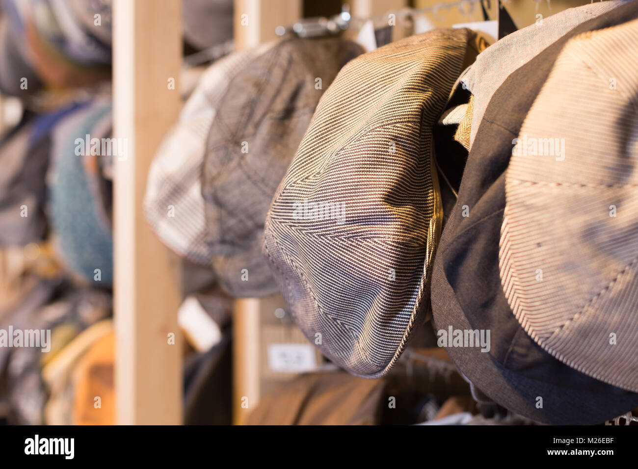 newboys cap hats hanging on the wall in the shopping mall Stock Photo Alamy