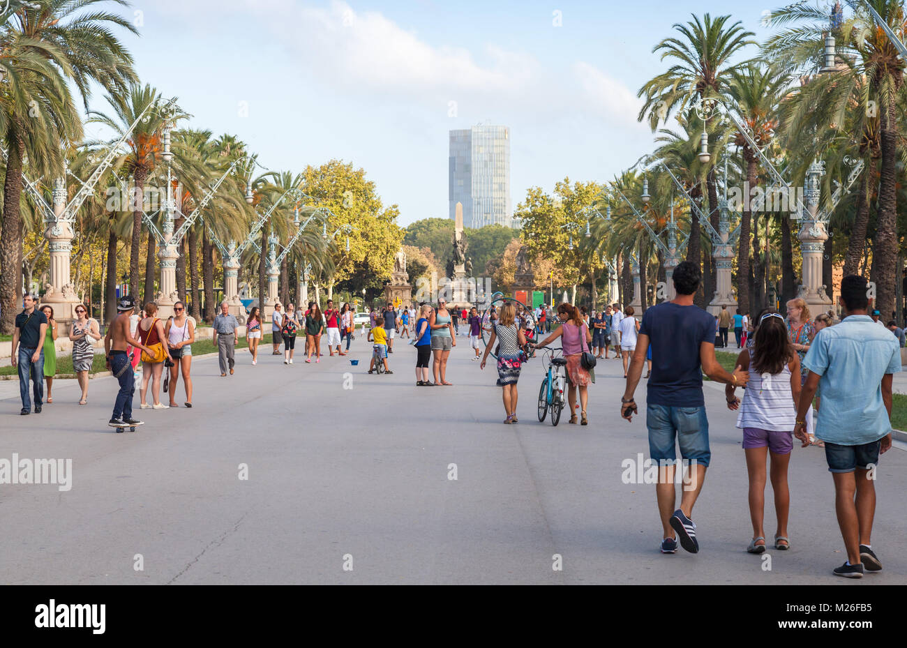 Barcelona, Spain - August 26, 2014: Passeig de Lluis Companys. People walk on promenade in the Ciutat Vella and Eixample districts of Barcelona, Spain Stock Photo