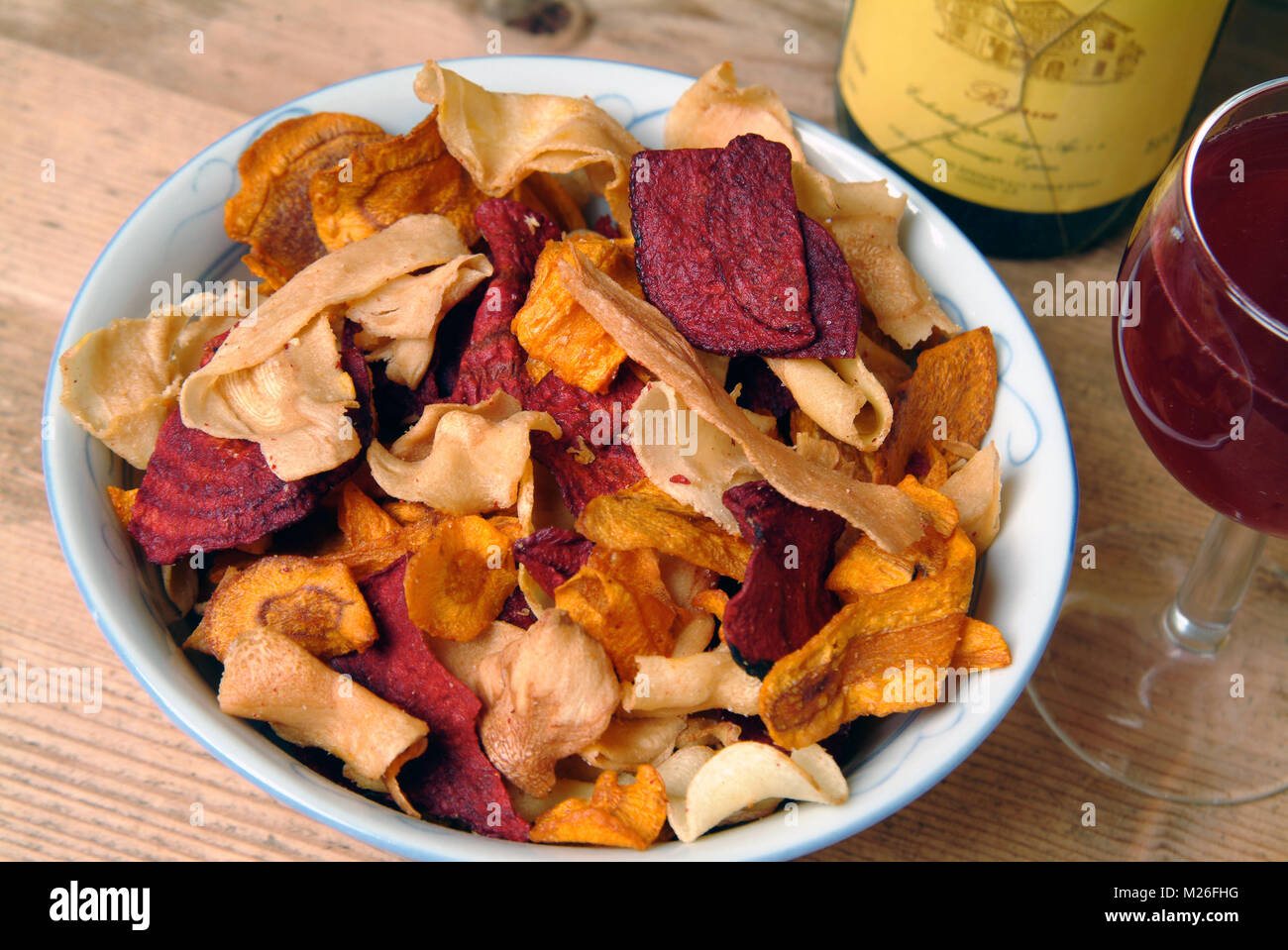 A bowl of root vegetable crisps Stock Photo Alamy