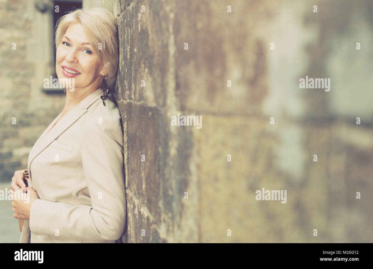 Young blonde woman posing near hi-res stock photography and images - Alamy