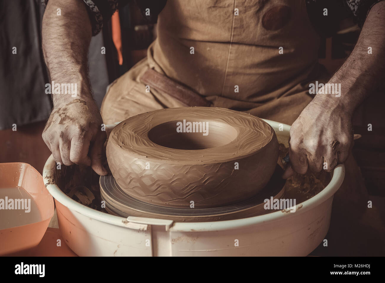 elderly man making pot using pottery wheel in studio Stock Photo Alamy