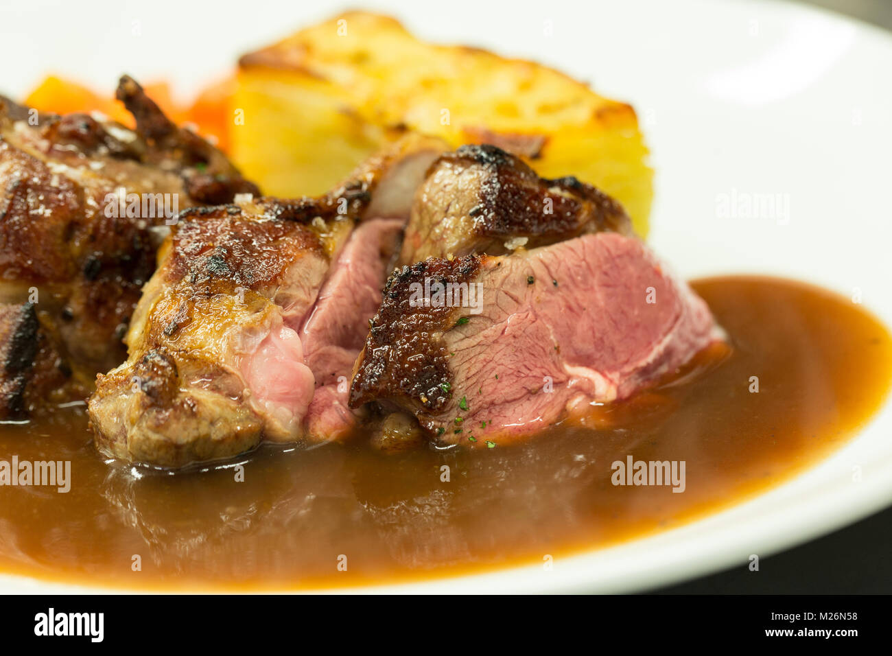 Duck with potato and root vegetables Stock Photo