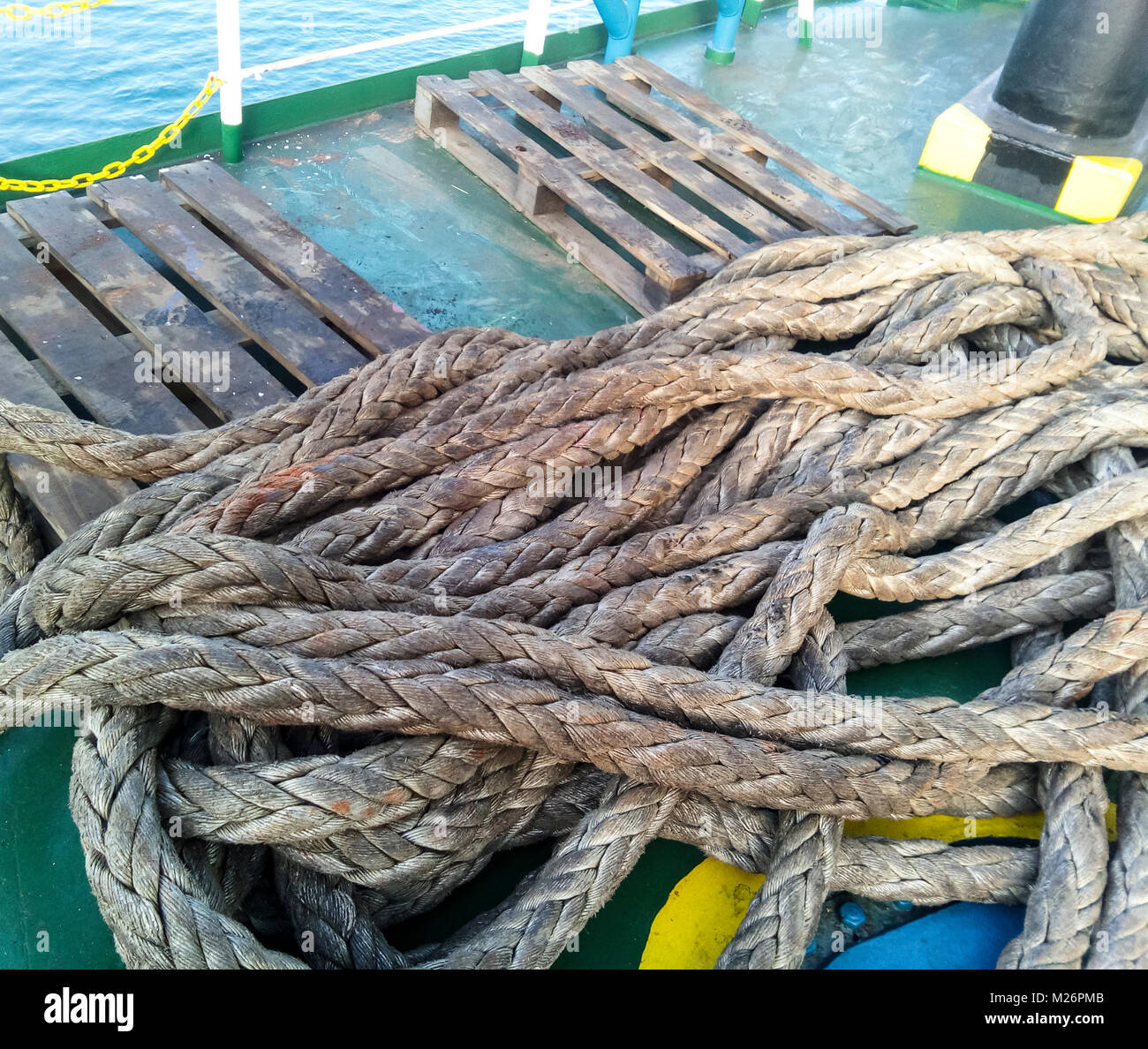 The sea rope on the deck of the ship Stock Photo - Alamy