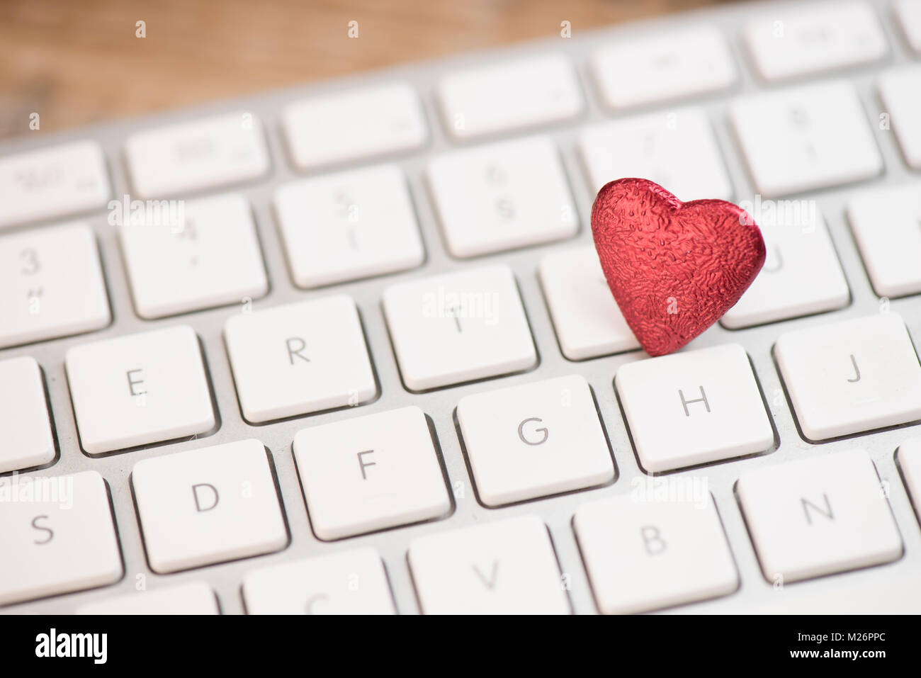 Small red heart on keyboard internet dating concept, Valentine Day ...