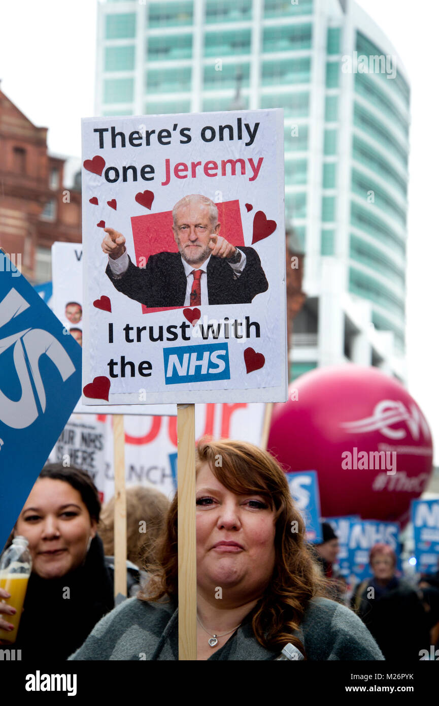 Demonstration called by the People's Assembly in support of the NHS (National Health Service}. A woman holds a placard with a photo of Jeremy Corbyn Stock Photo