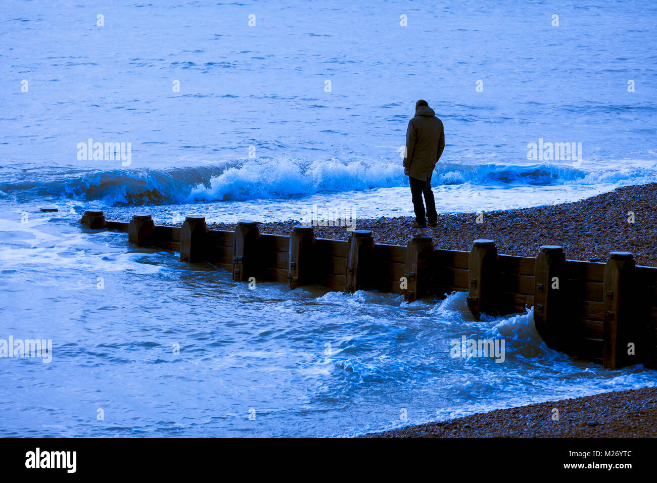 A solitary man looking out to sea Stock Photo Alamy