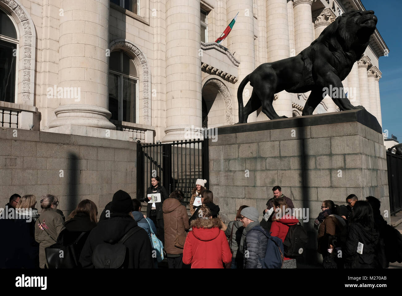 Tourists gathered for a free tour in front of the Sofia Court House in the city of Sofia capital of Bulgaria. Stock Photo