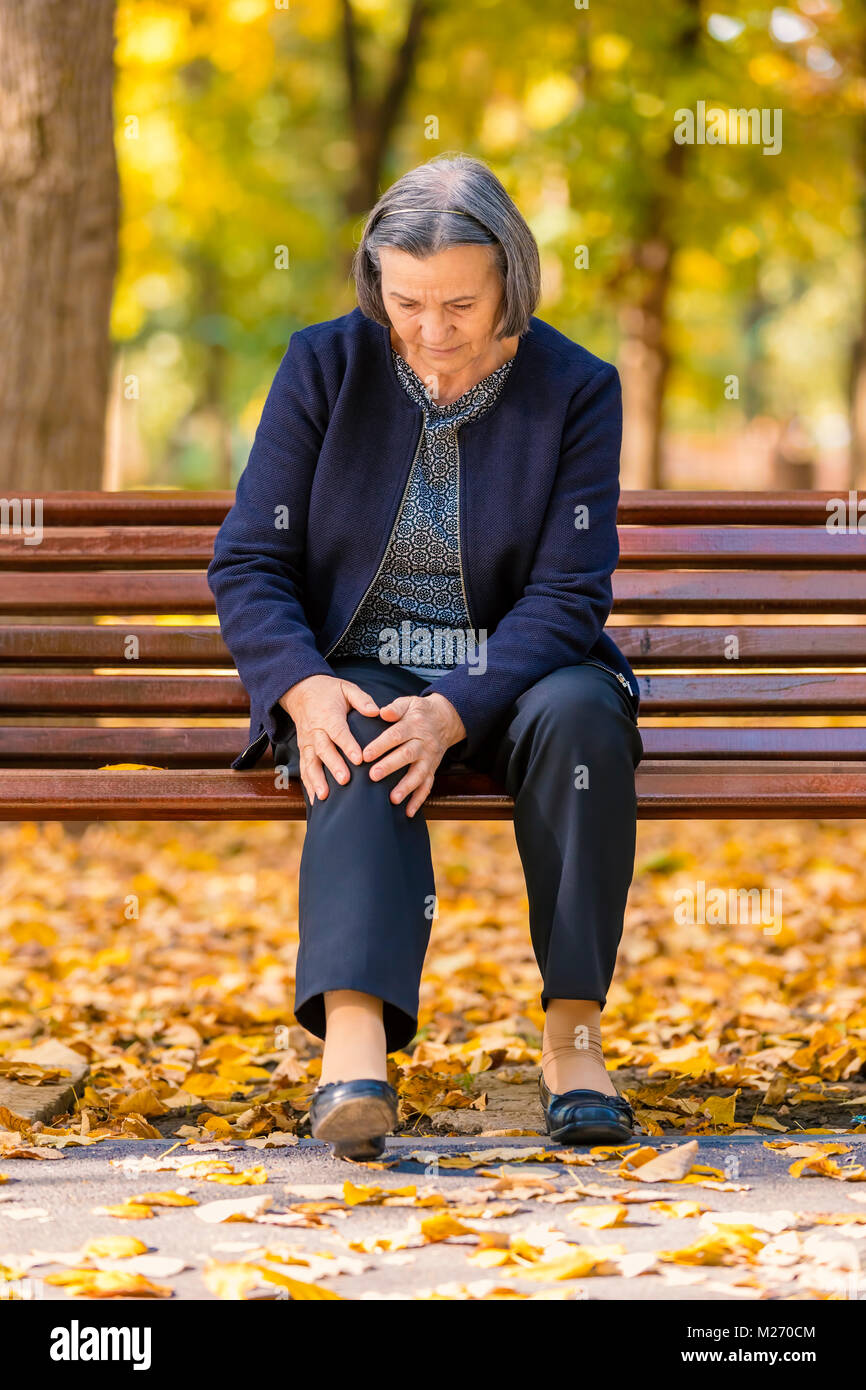 Mature woman alone walking park hi-res stock photography and images - Alamy