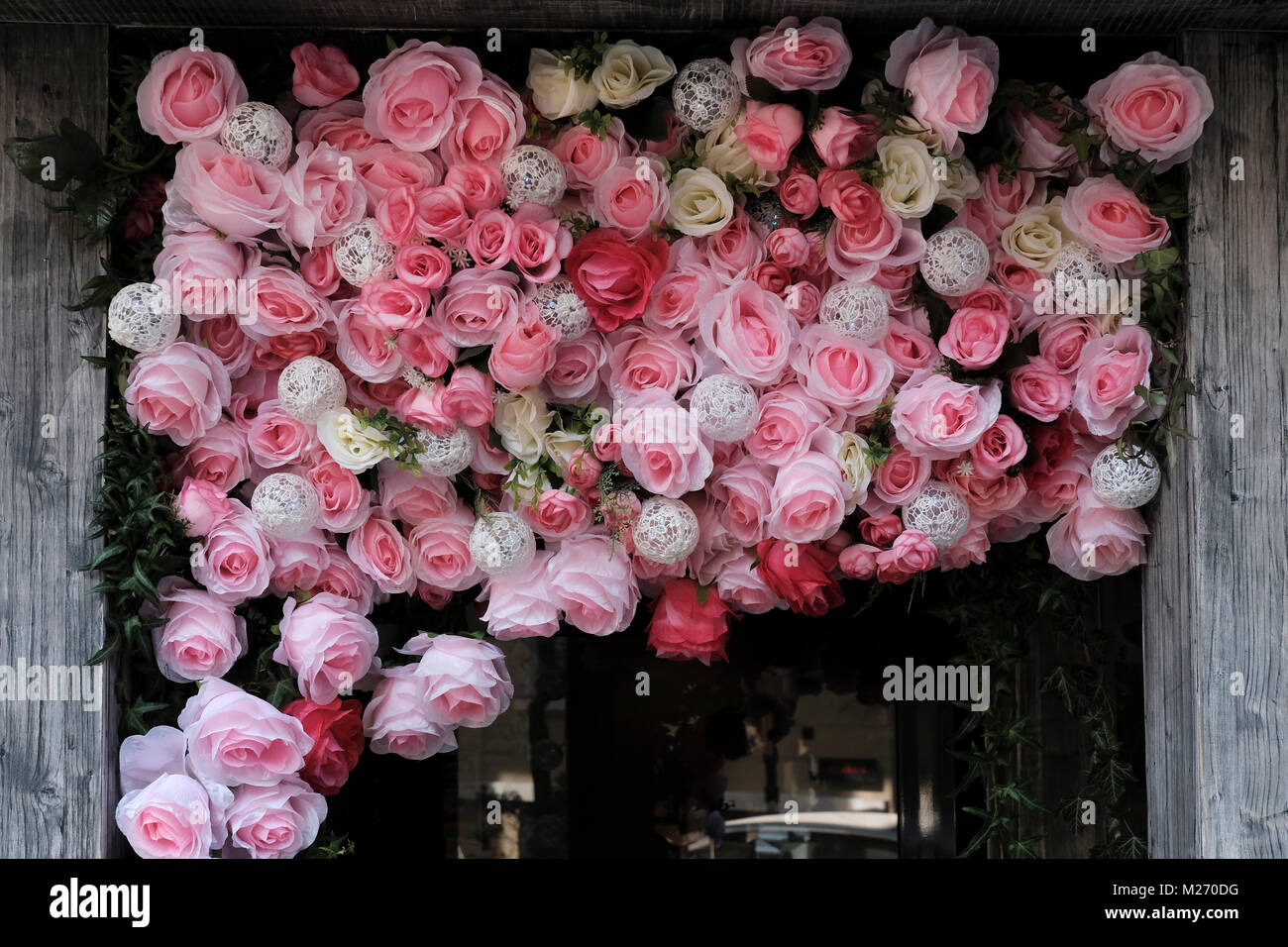Fabric roses decorating a doorway of a shop in the city of Sofia Stock