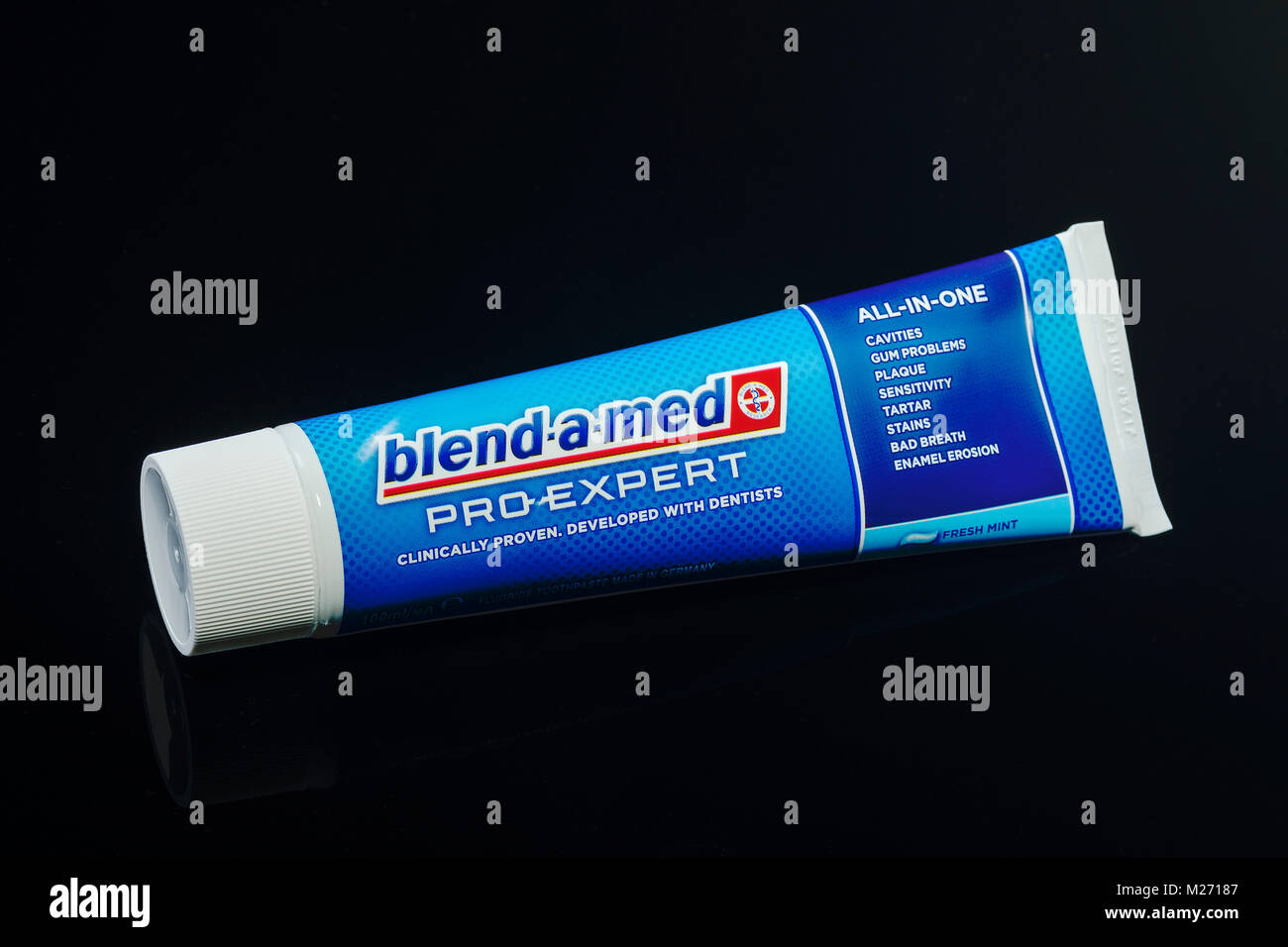 Blend-a-med toothpaste isolated on gradient background. Stock Photo