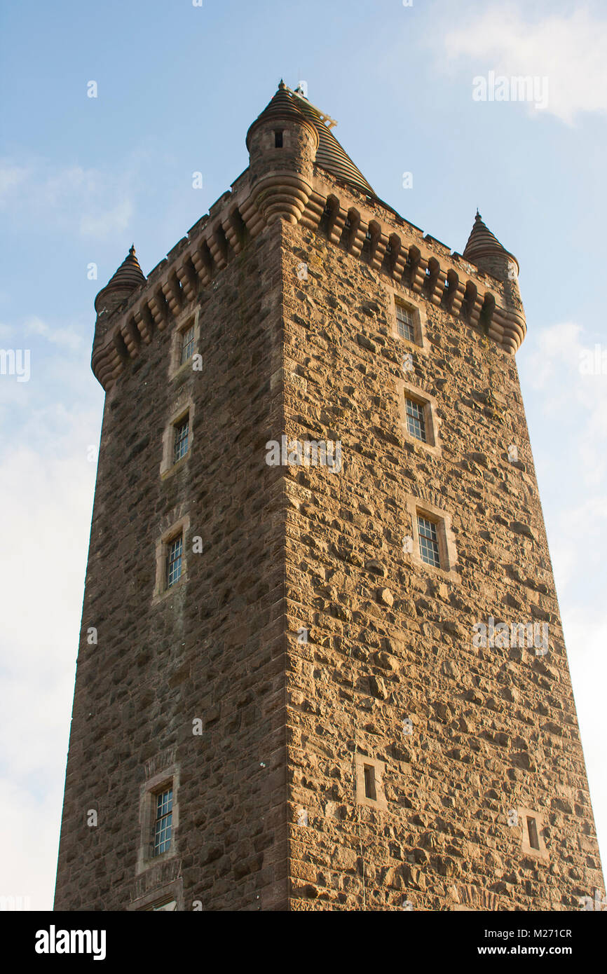Close up view of the turreted Scrabo Tower in Newtownards County Down showing the rough surface texture of the unique Scrabo stone with which it was b Stock Photo