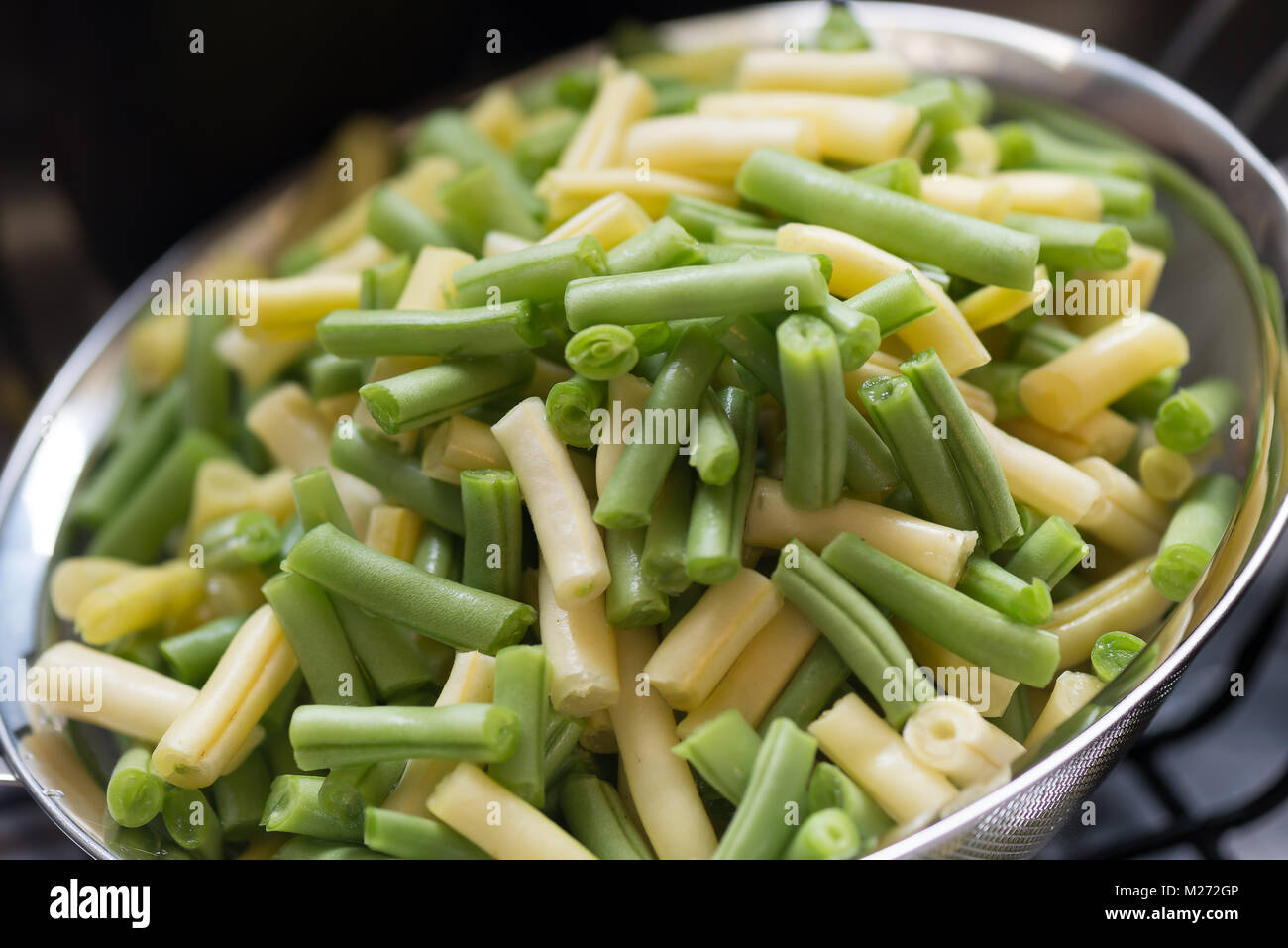 Wax and Green Beans in a strainer Stock Photo