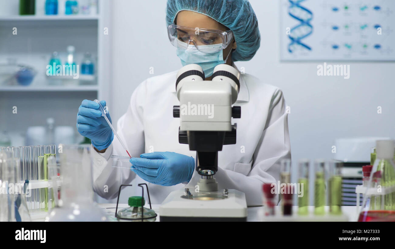 Medical analyst doing biochemical blood research at laboratory, health care Stock Photo