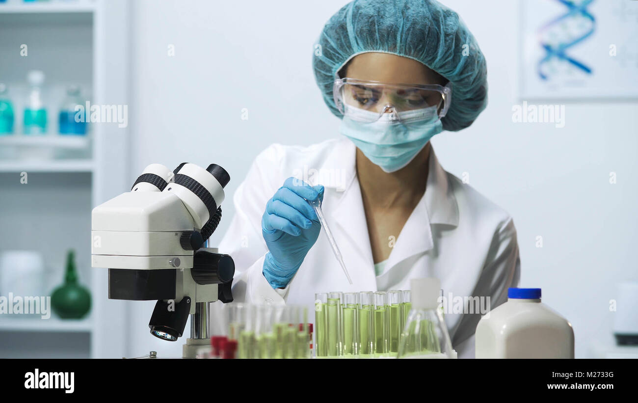 Laboratory worker collecting biological material, biochemical investigation Stock Photo