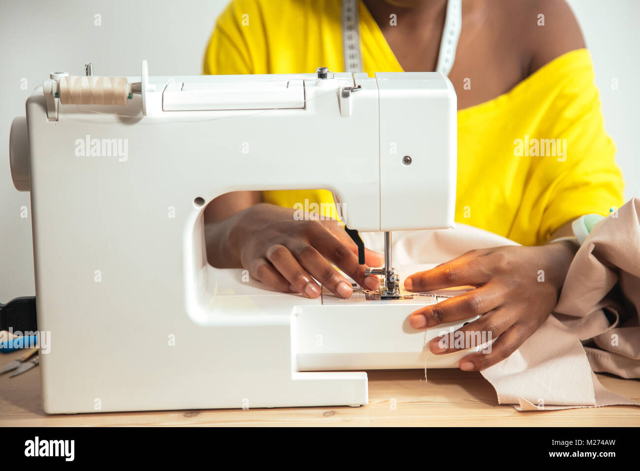 Close-up seamstress hands working on sewing machine at home Stock Photo ...