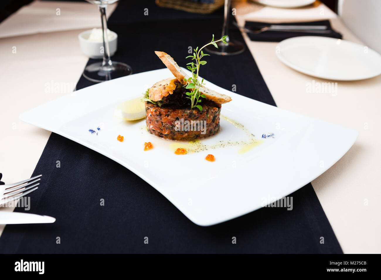 Salmon tartar with red caviar Stock Photo