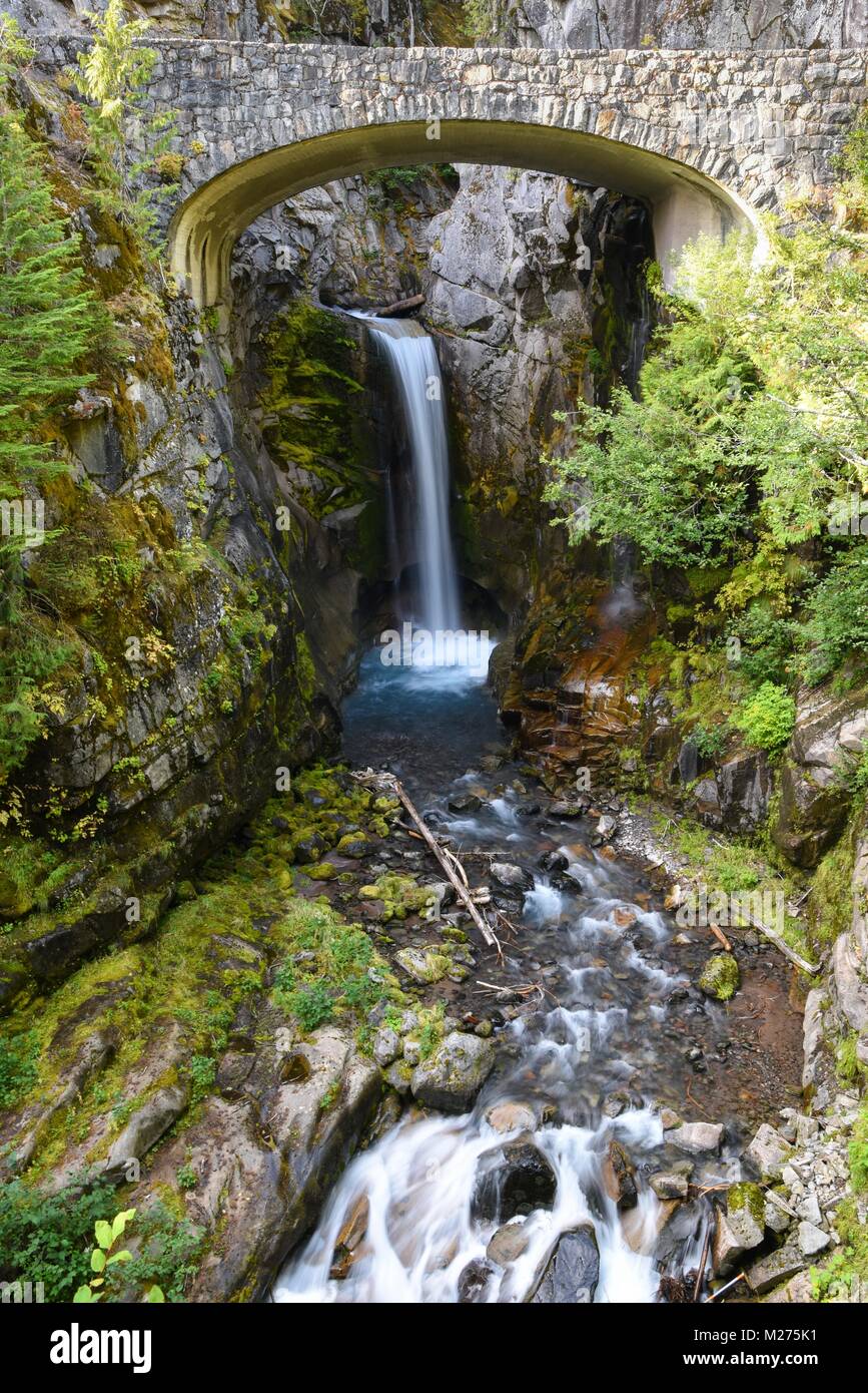 Beautiful Christine Falls under the bridge in Mount Rainier National Park, Washington state, USA long exposure to blur the water motion Stock Photo