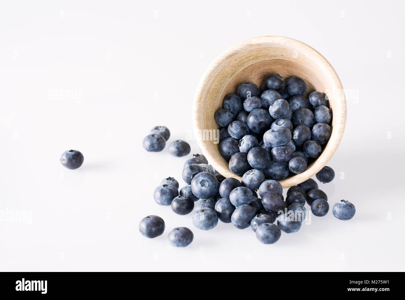 Vaccinium corymbosum. Blueberries in a wooden pot. Stock Photo
