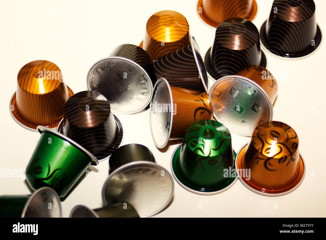 various new 'limited edition' colorful nespresso coffee pods/ capsules on white background Stock Photo