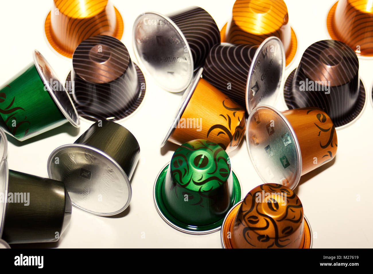 various new 'limited edition' colorful nespresso coffee pods/ capsules on white background Stock Photo