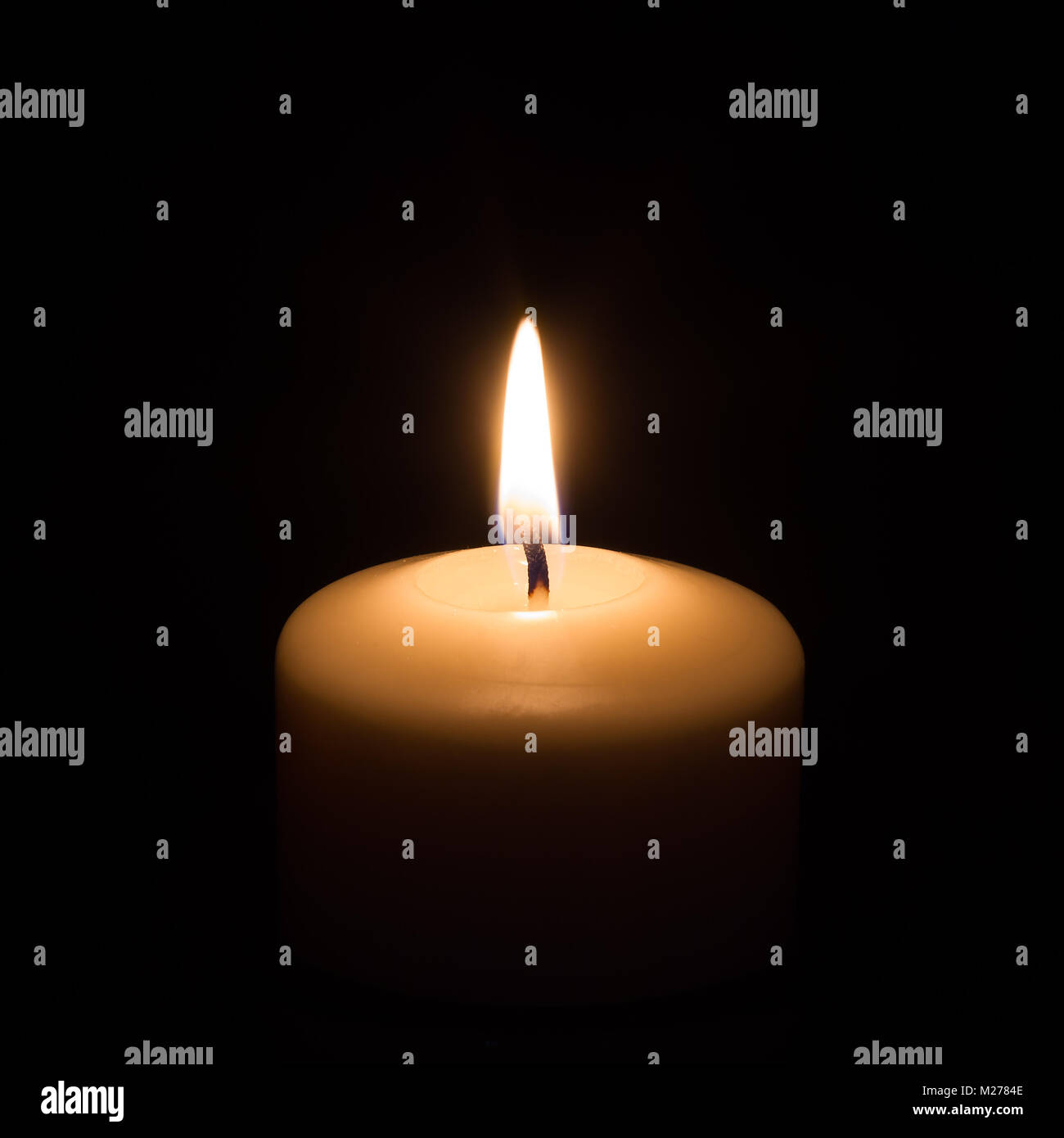 Candle on black background Stock Photo - Alamy
