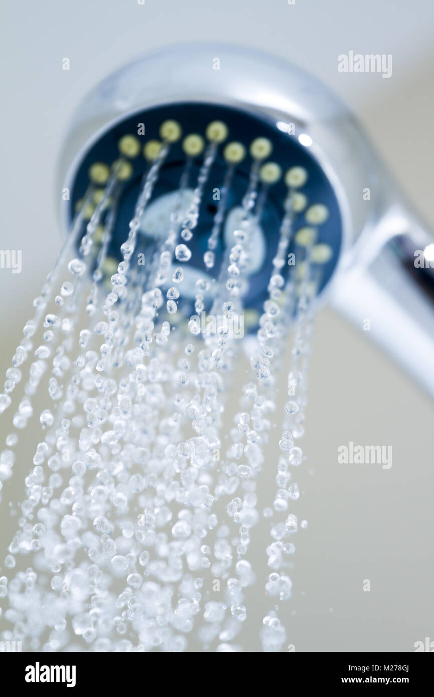 Shower head with frozen water droplets in the bathroom Stock Photo Alamy