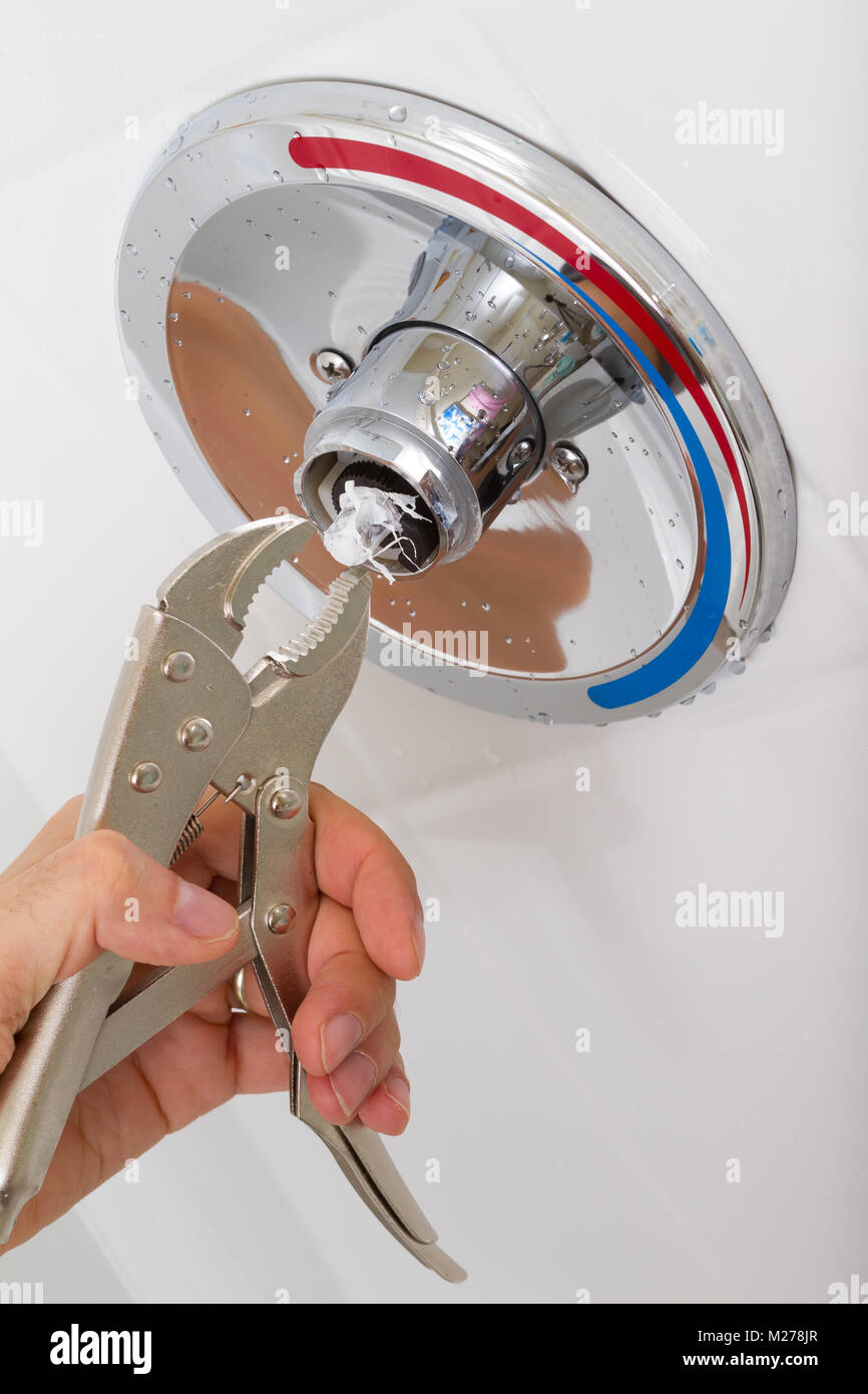 Fix of broken shower faucet cold and hot water in the bathroom Stock Photo