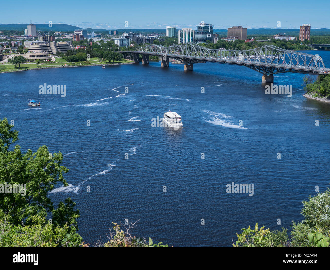 Boats on the Ottawa River near the Alexandra Bridge, Ottawa, Ontario, Canada. Stock Photo