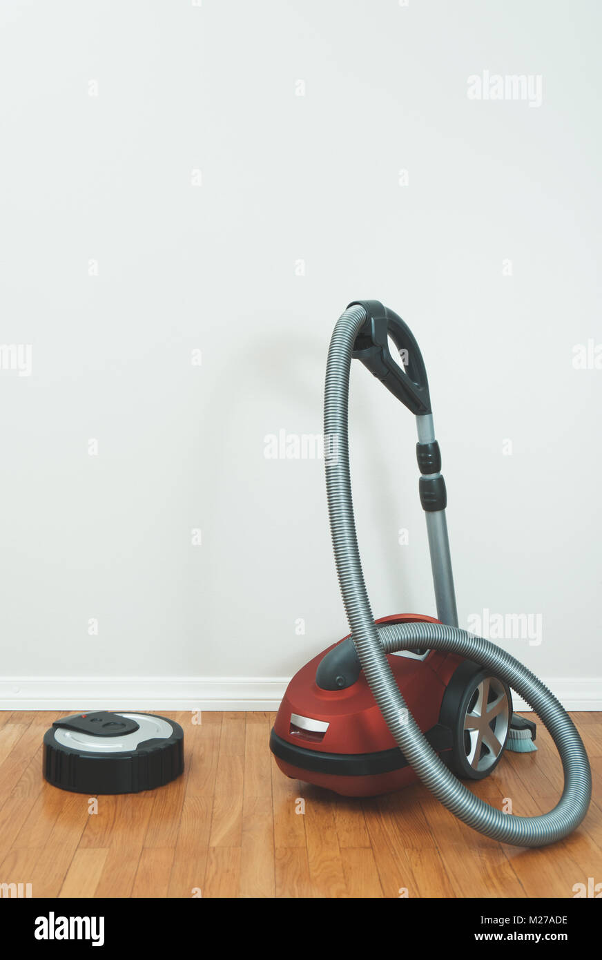 Robotic vacuum cleaner vs Vacuum cleaner Stock Photo Alamy