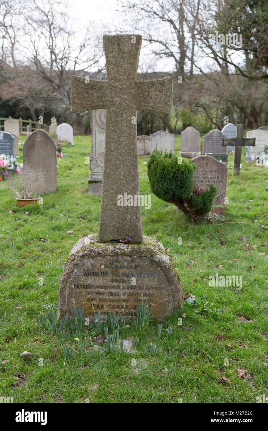 The grave of Arthur Conan Doyal at All Saints Churchyard in Minstead, England. Doyle was an author and the creator of the character Sherlock Holmes. Stock Photo