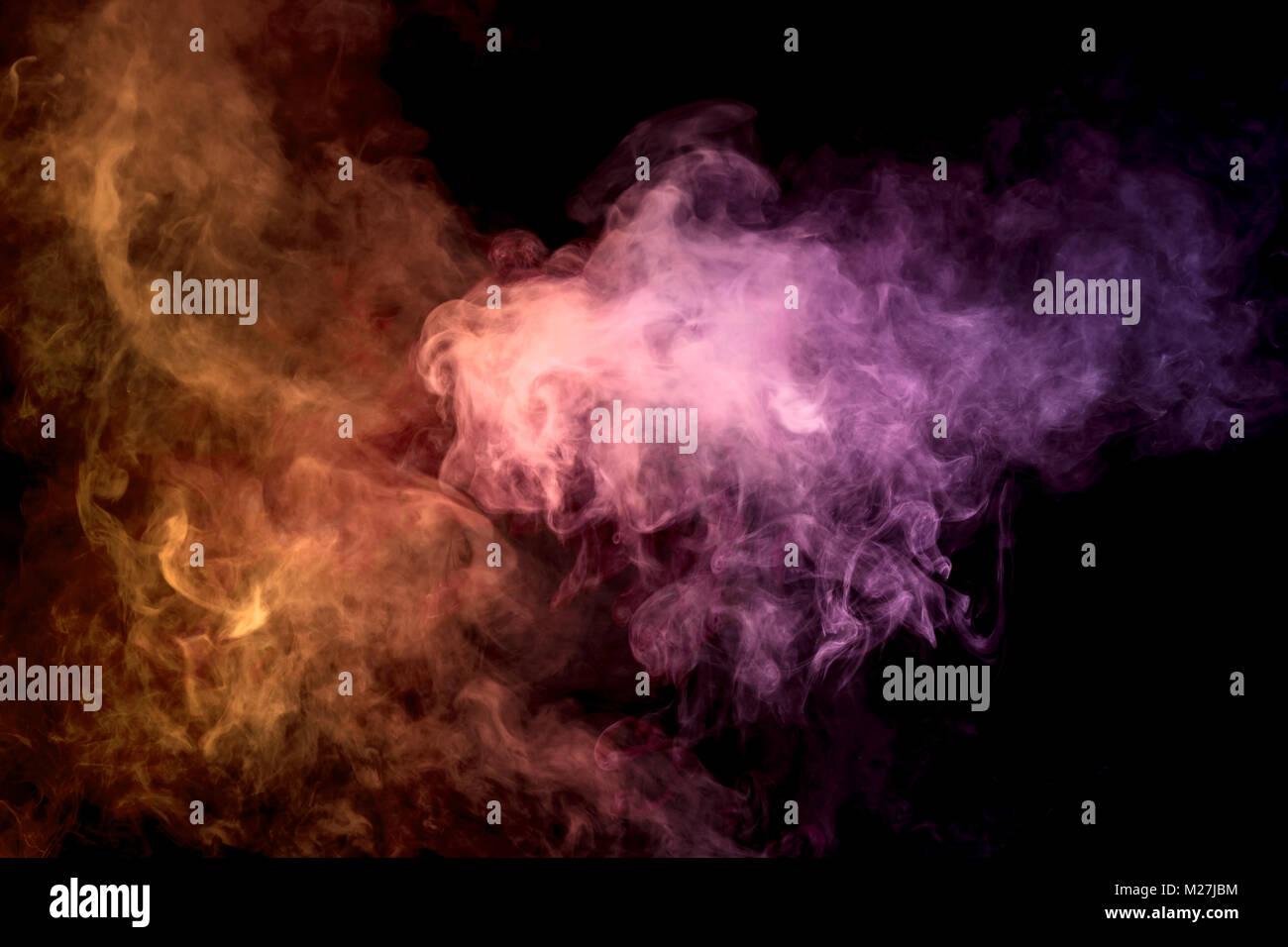 Colorful orange and pink smoke clouds on dark background.Background of ...