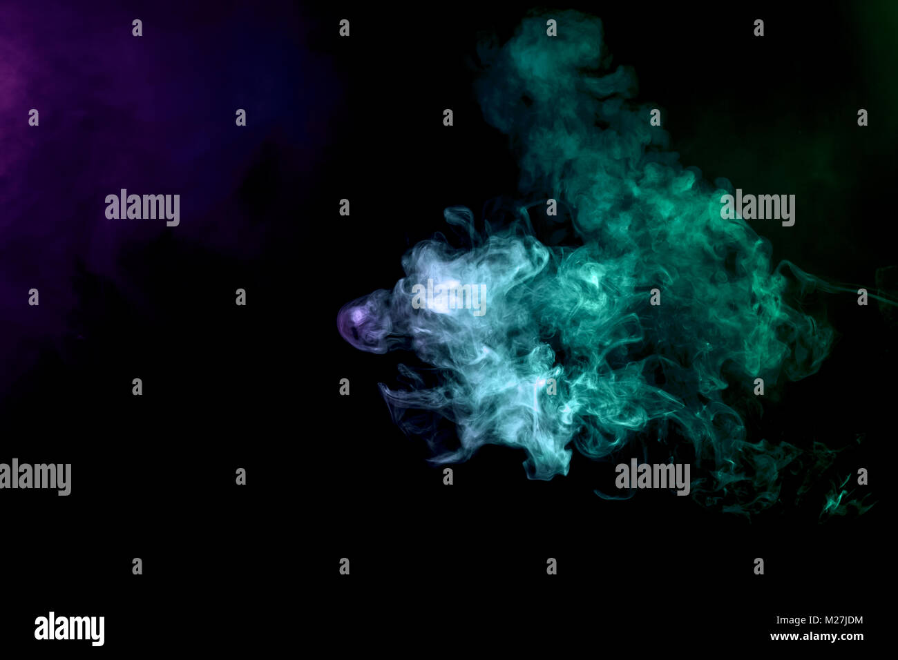 Blue and green cloud of vape smoke on black isolated background Stock ...