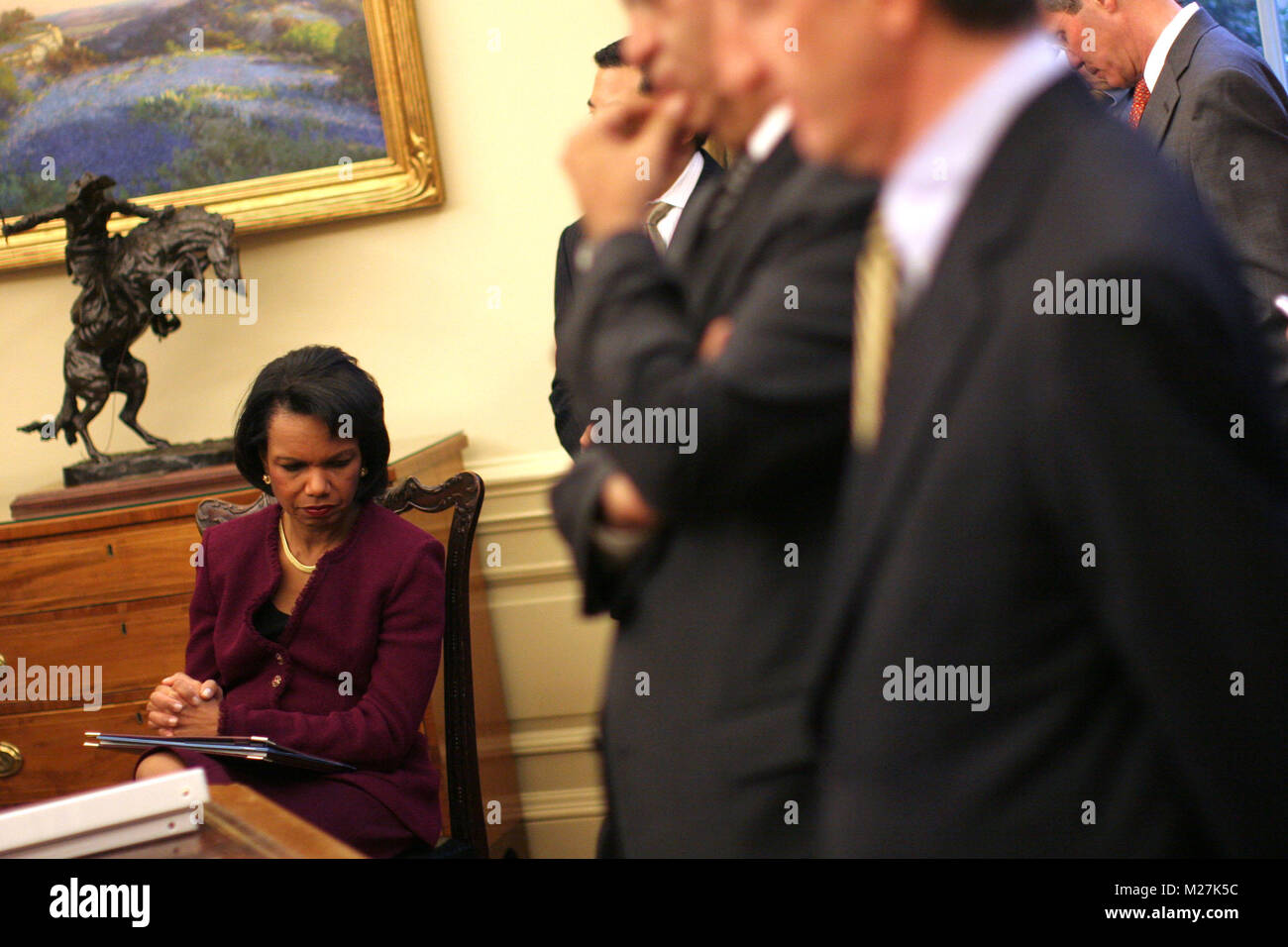 Washington, DC - December 19, 2008 -- United States Secretary of State Condolezza Rice listens as United States President George W. Bush meets with the President Mahmoud Abbas (Abu Mazen) of the Palestinian Authority in the Oval Office of the White House in Washington DC on Friday, December 19, 2008..Credit: Ken Cedeno / Pool via CNP /MediaPunch Stock Photo
