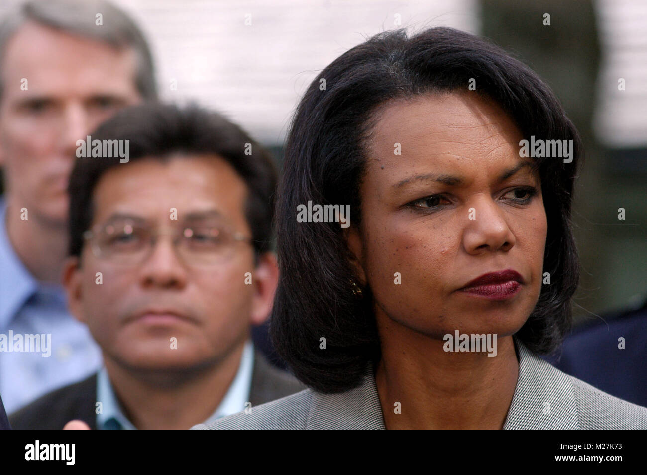 Camp David, MD - June 12, 2006 -- United States Secretary of State Condoleezza Rice watches as President George W. Bush speaks to members of the press about his meetings with top advisors at Camp David. President Bush held the meetings to reassess US military strategy in the war in Iraq.  Attorney General Alberto Gonzales is at left. Credit: Evan F. Sisley - Pool via CNP /MediaPunch Stock Photo