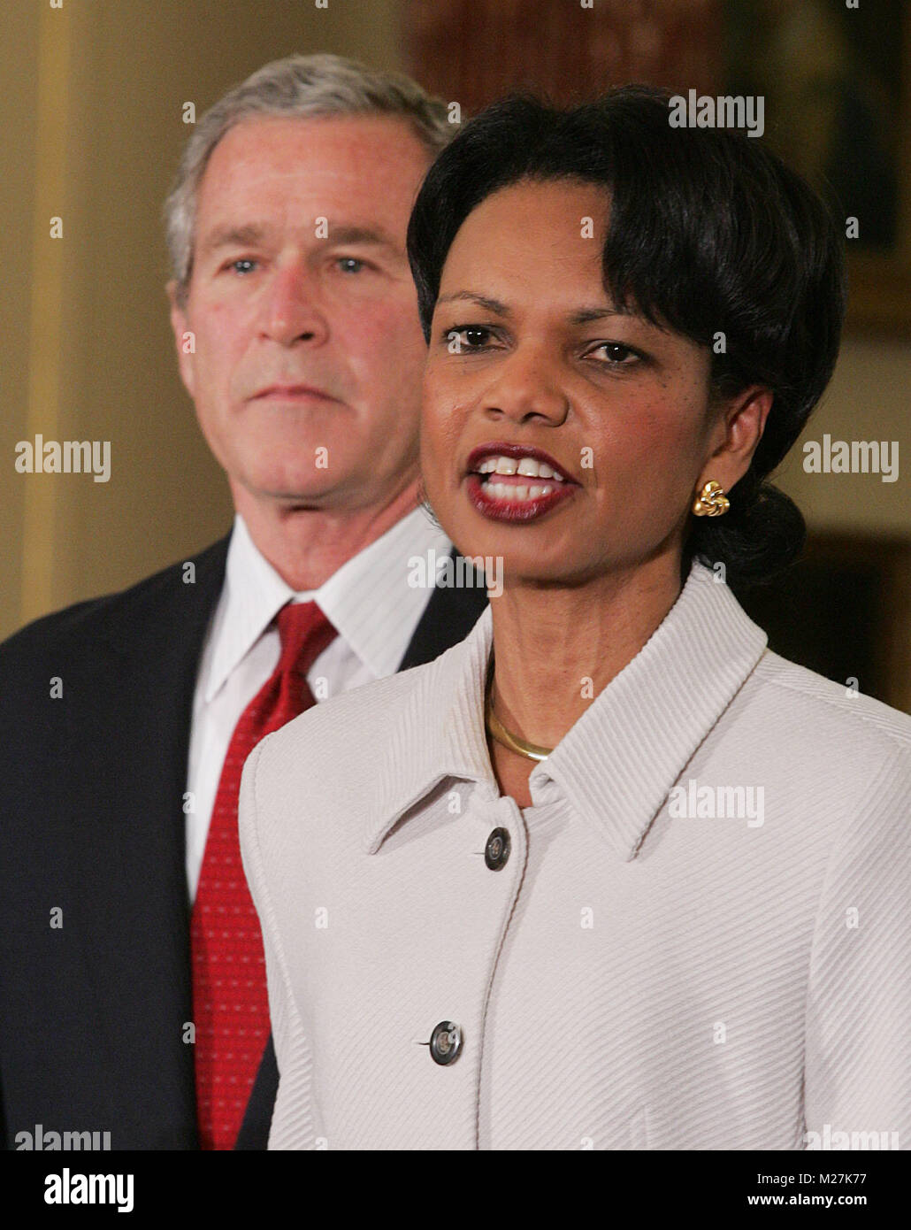 US President George W. Bush listens as Secretary of State Condoleezza ...