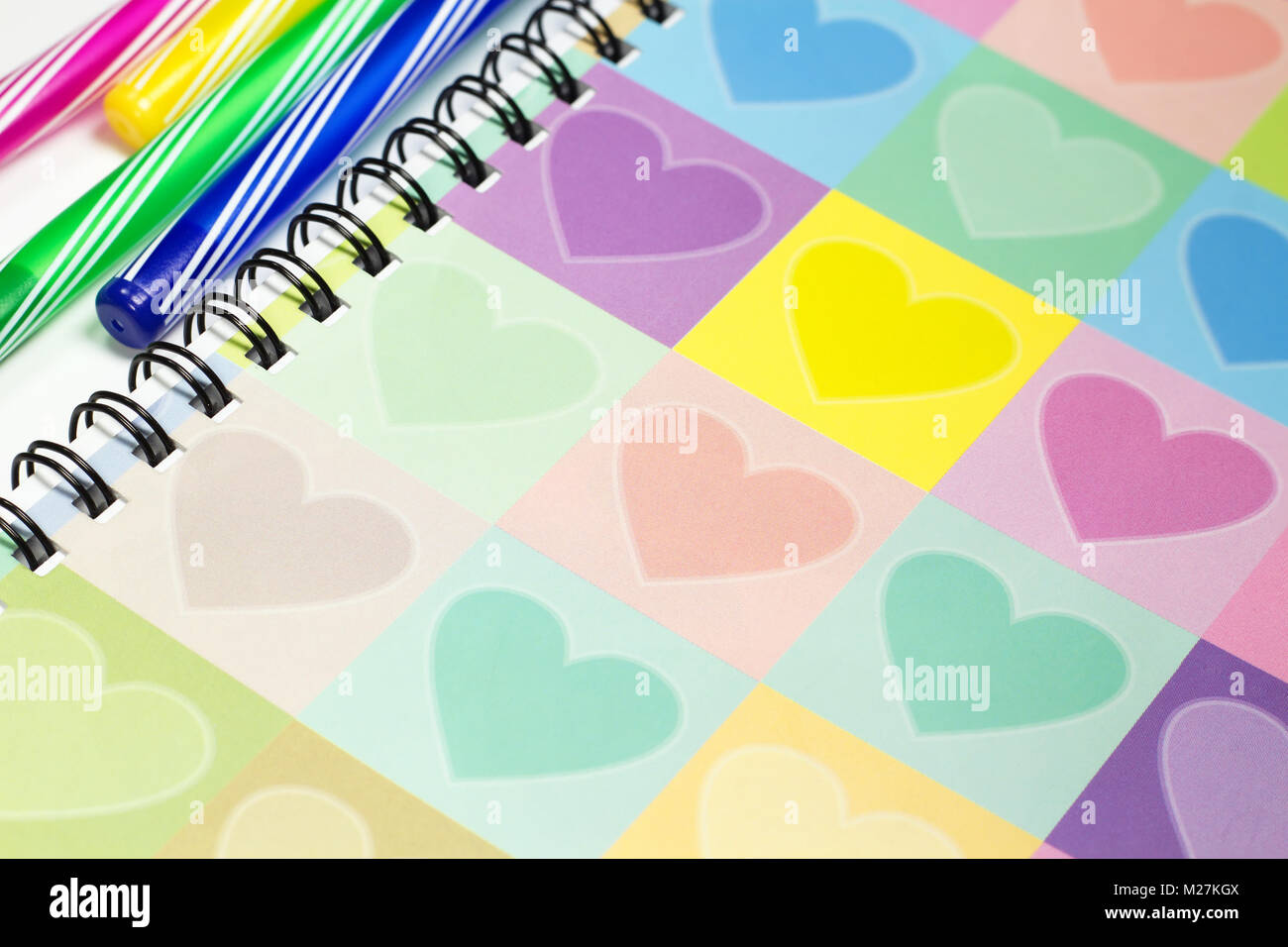Colorful heart graphic cover notebook, diary with colorful pen for business concept Stock Photo