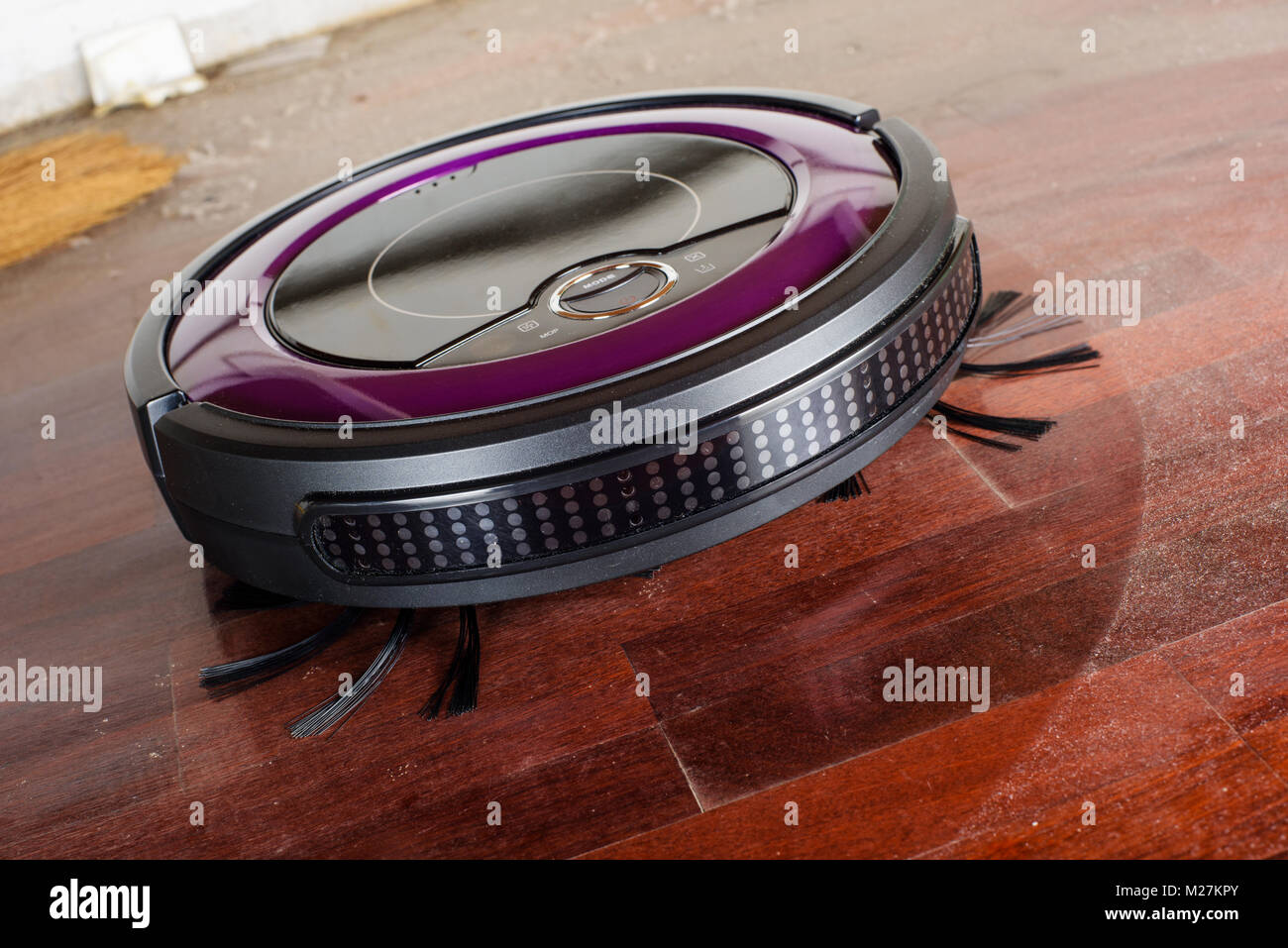 robotic vacuum cleaner cleaning the dusty floor Stock Photo Alamy