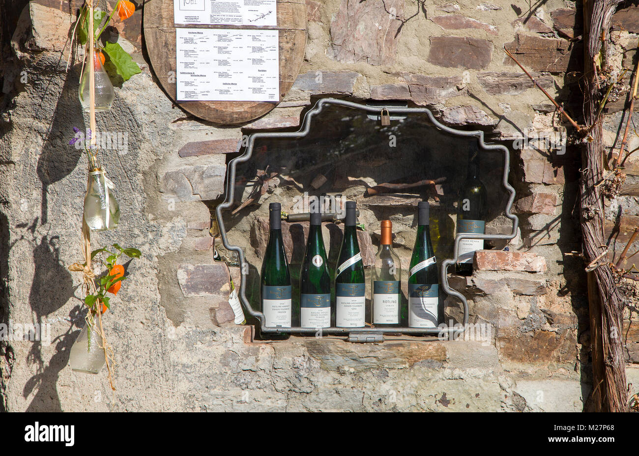 Wine sortiment in a hole of a mural (house wall), wine villag Ediger-Eller, Moselle river, Rhineland-Palatinate, Germany, Europe Stock Photo