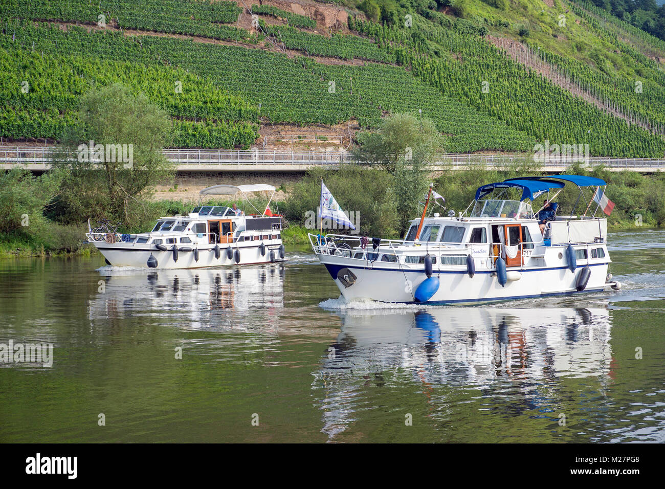 Two cabin boats on Moselle river at wine village Bruttig-Fankel, Rhineland-Palatinate, Germany, Europe Stock Photo