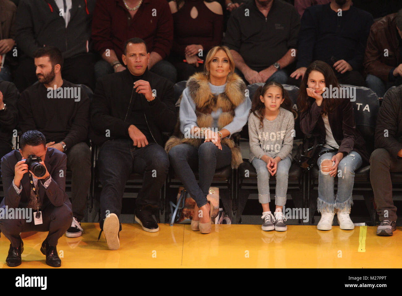 Jennifer Lopez watches the Los Angles Lakers game along with her twins