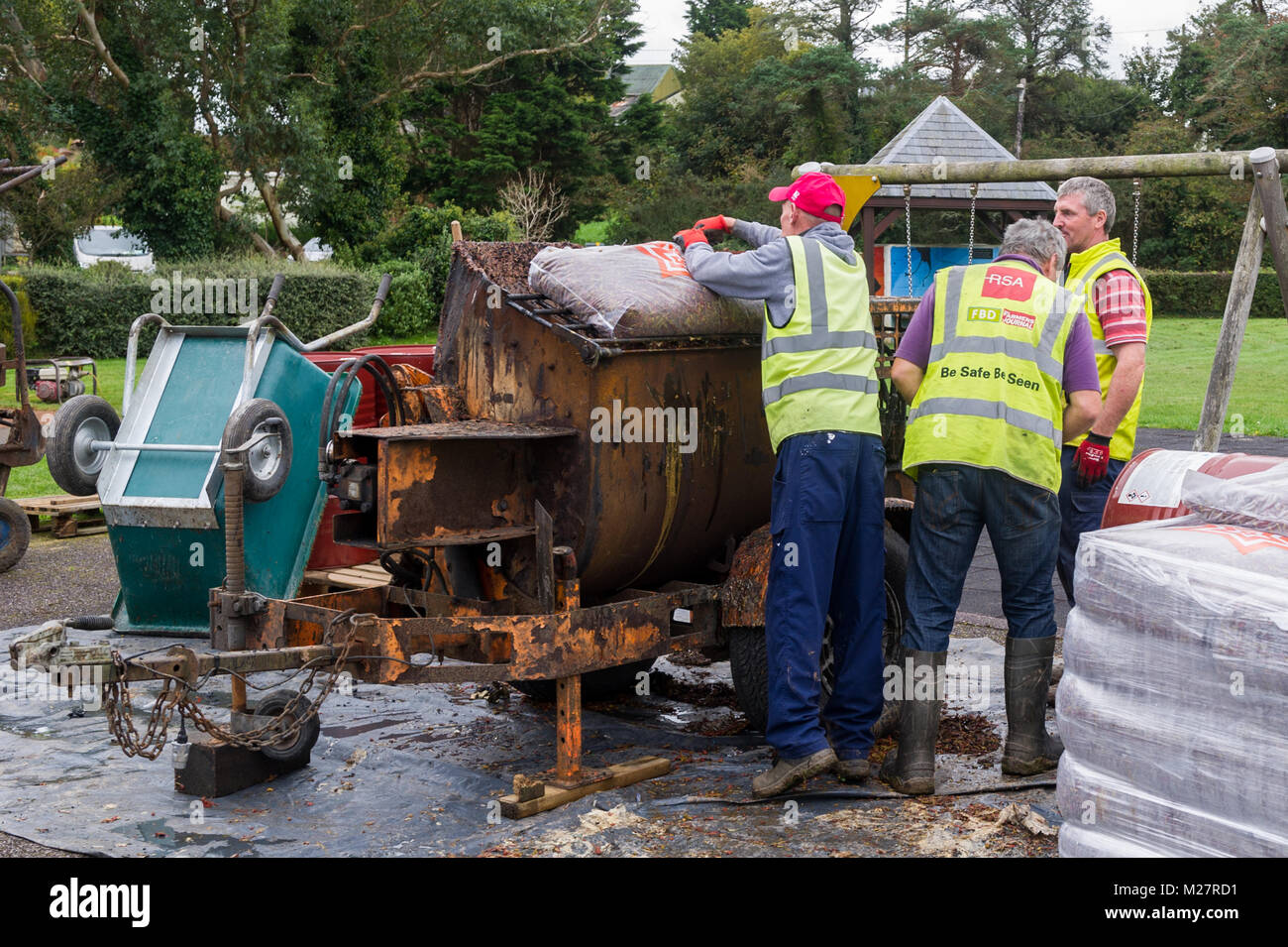 Workmen undergo improvements on Ballydehob Playground, County Cork, Ireland. Stock Photo