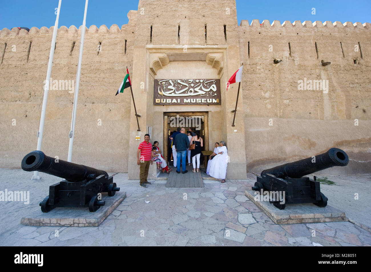 DUBAI, UNITED ARAB EMIRATES - JAN 02, 2018: The entrance of the Dubai museum with two cannons in front. It's a famous place visited by tourists. Stock Photo