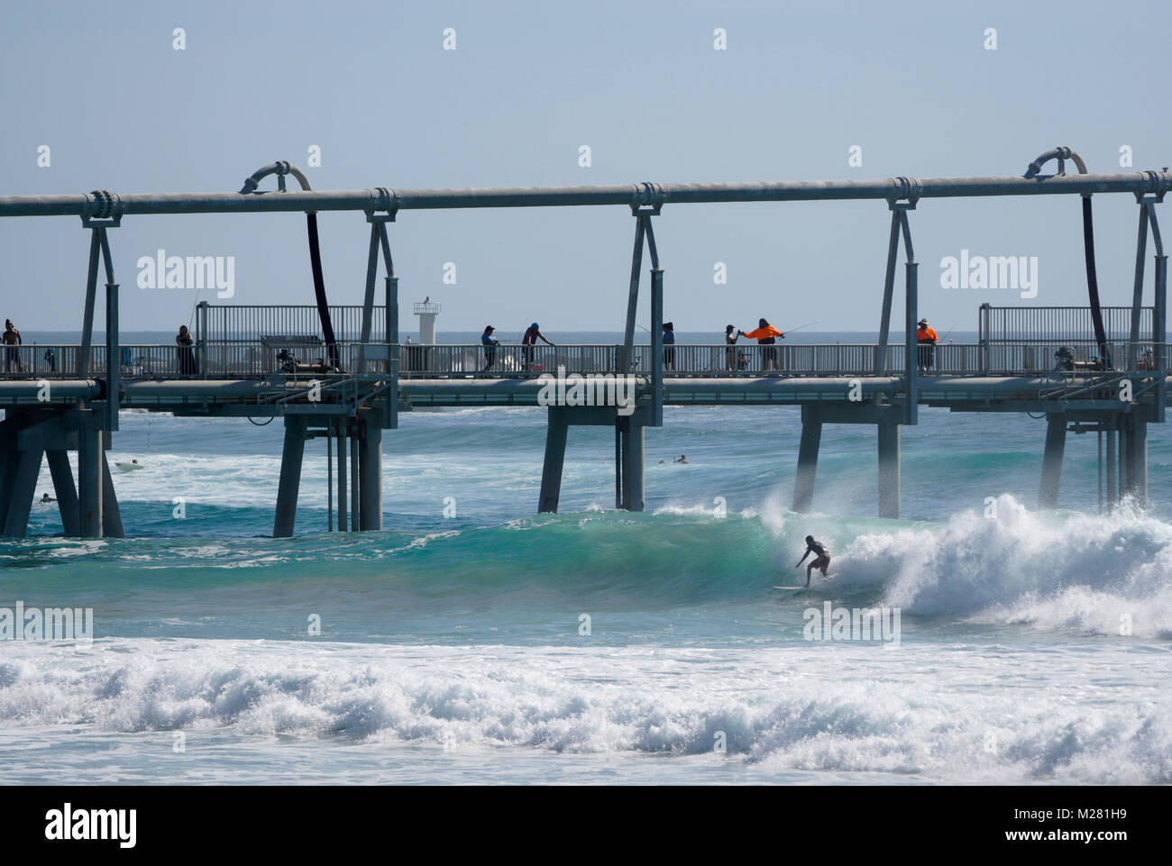 Surfing and fishing at The Spit, on the Gold Coast in Australia Stock Photo Alamy