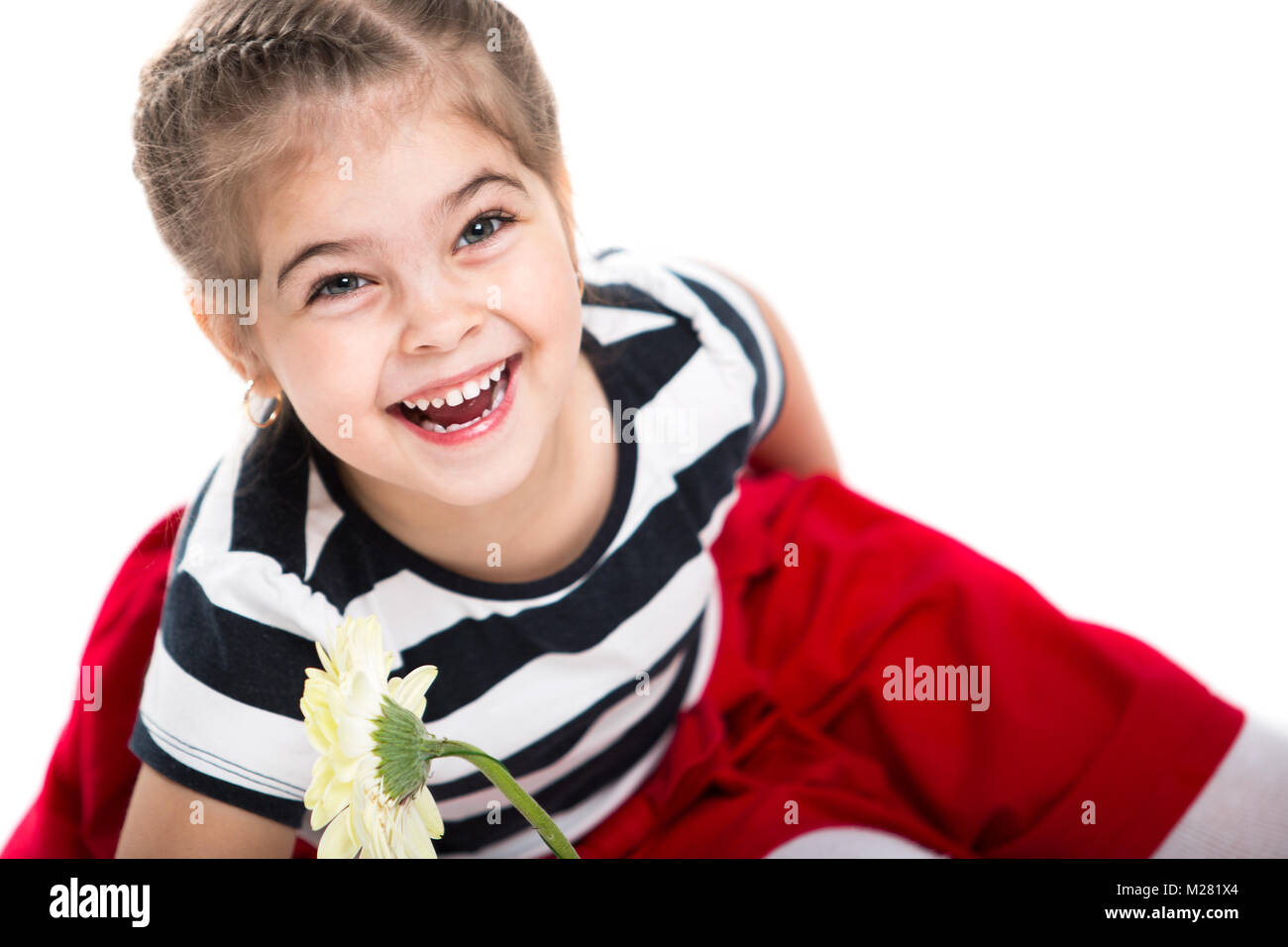 Portrait of a beautiful little cheerful girl on a white background. The ...