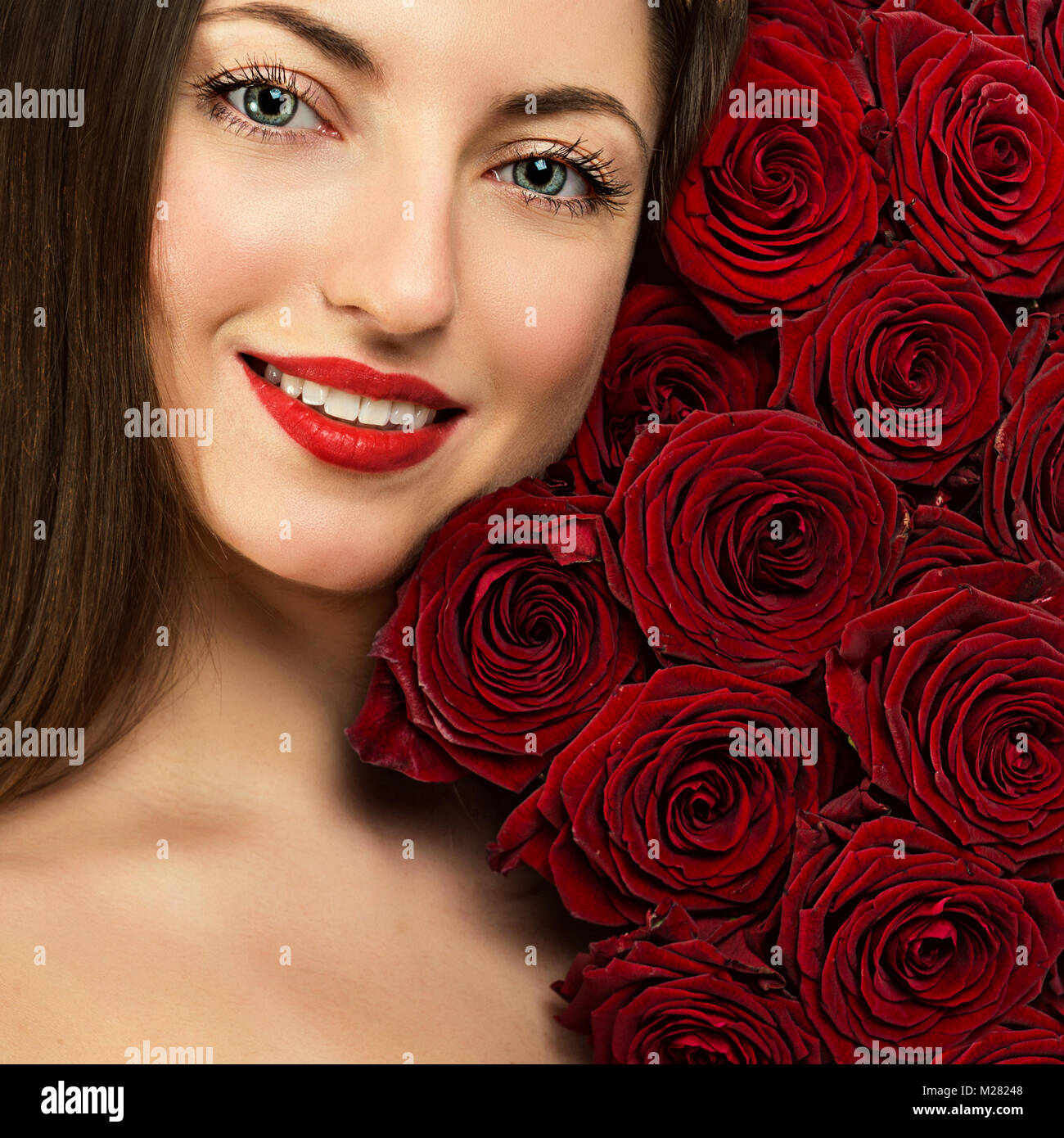 Portrait of a beautiful young woman with a bouquet of flowers Stock ...